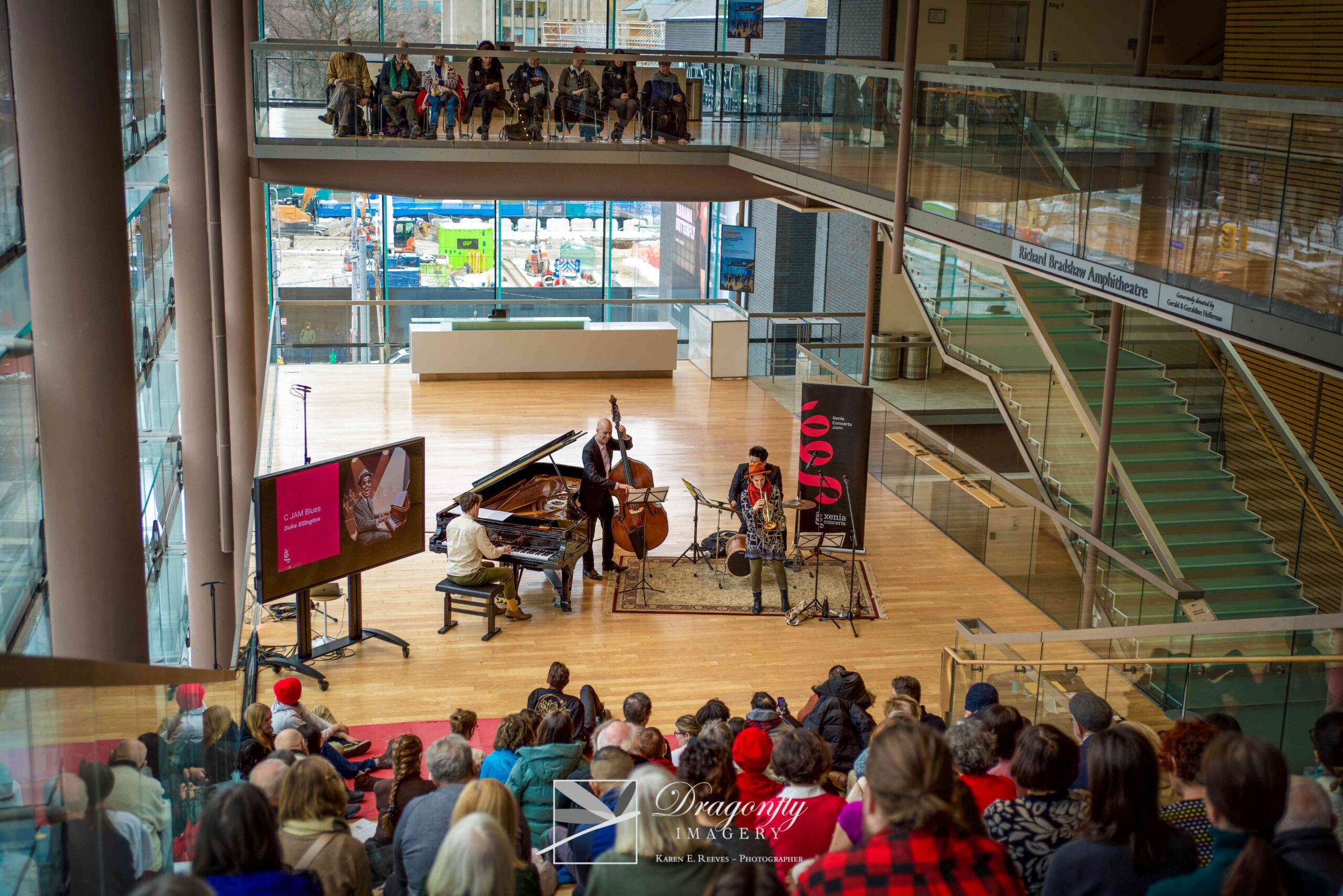 A jazz band performs in a large atrium in a performing arts centre